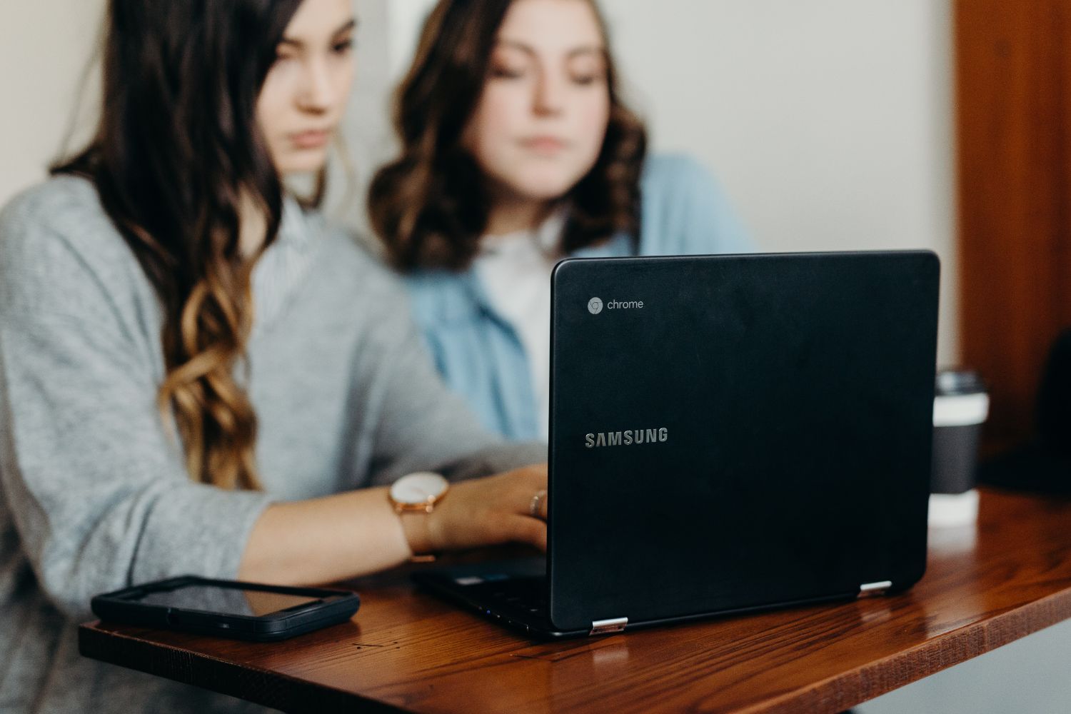 Colleagues working at laptop