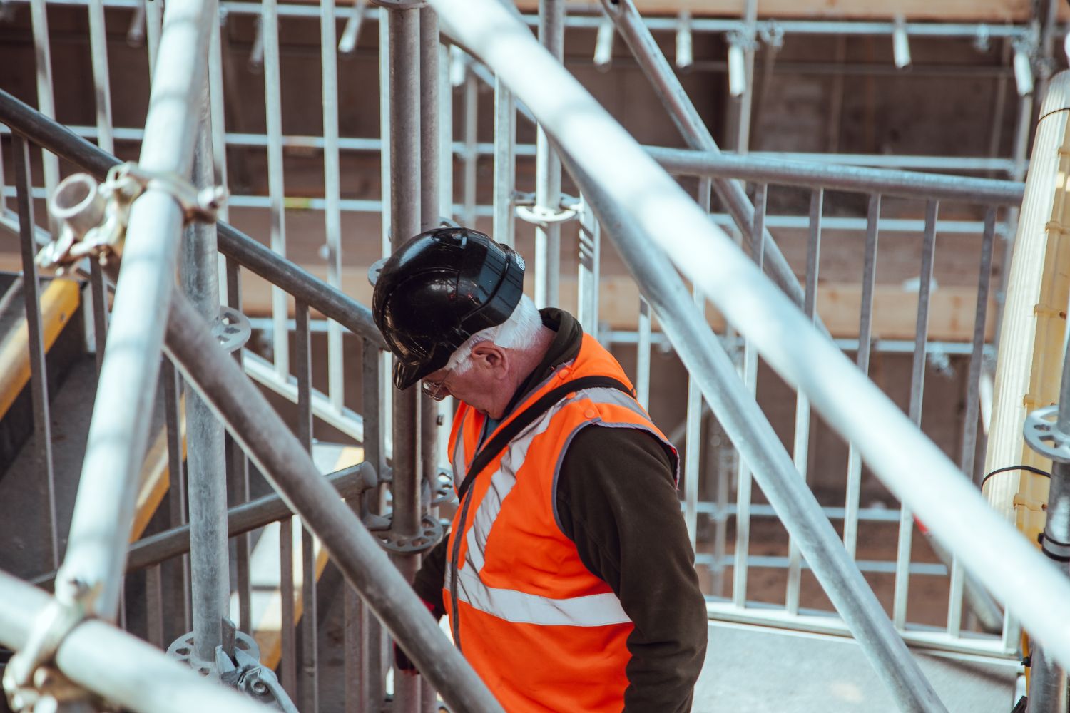 Person on building site wearing hard hat