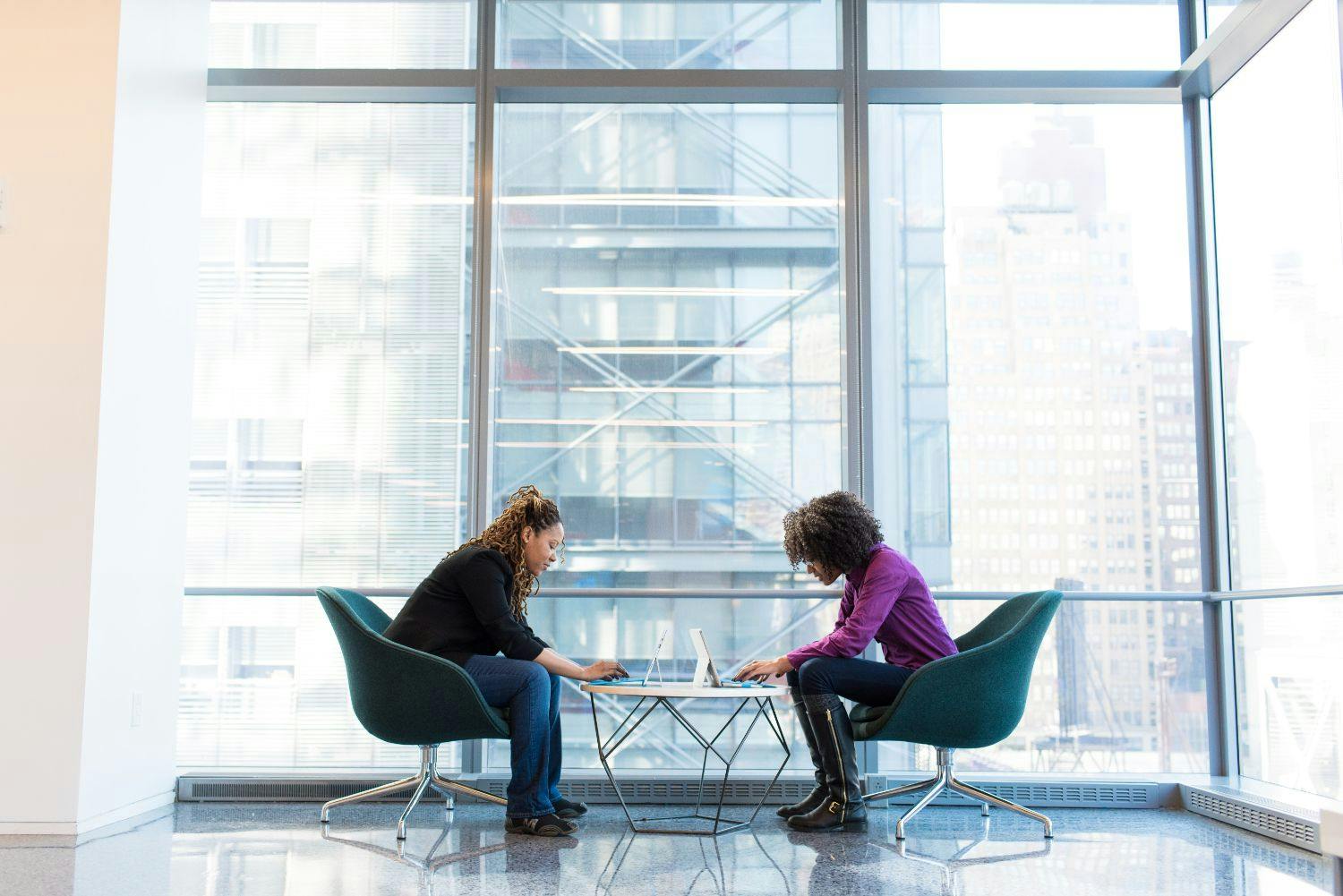 two females having a meeting